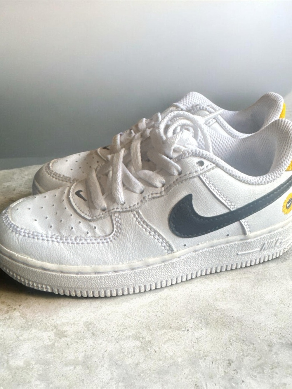 Nike Kids White Leather Sneakers with Black Swoosh and Yellow Accent